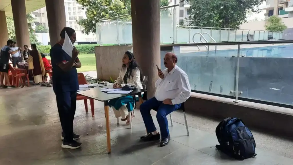 Dr. Chaitali (Lady General Physician) consulting residents in the health camp