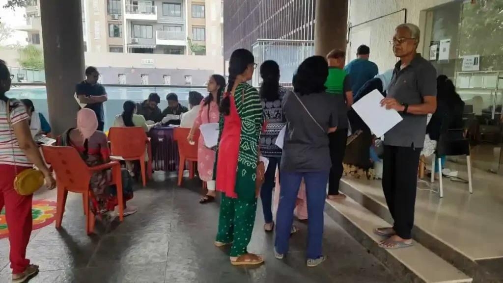 Residents of Mahindra Antheia, Pimpri waiting for consultations from doctors.