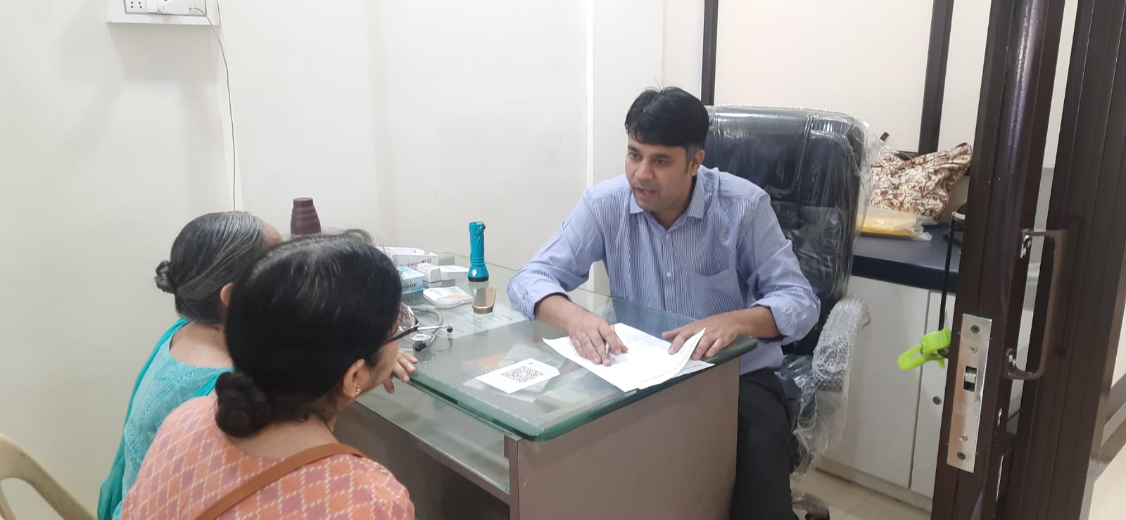 Dr. Mayuresh giving consultations to patients